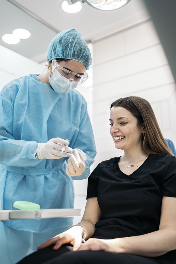 Dentist consulting with patient at Bittern Dental