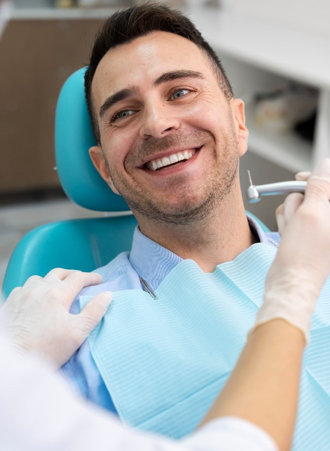 Dentist consulting a patient with a smile